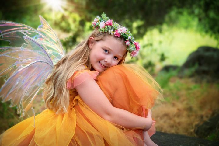 Little girl dressed as a fairy in a yellow tutu